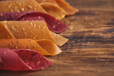 Fruit and berry pastille, dessert with nuts and seeds wooden background