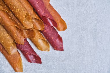 Fruit and berry pastille, dessert with nuts and seeds on a light background