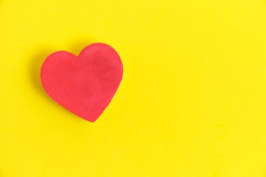 Red heart bright yellow background