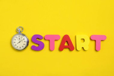 Word start and stopwatch yellow background