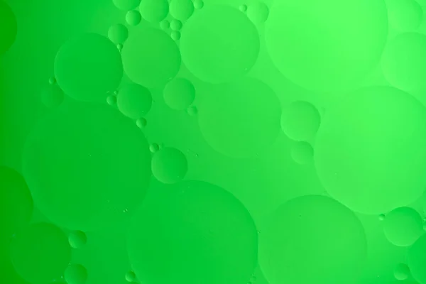 緑色の油円とグラデーションのある抽象的な背景 — ストック写真