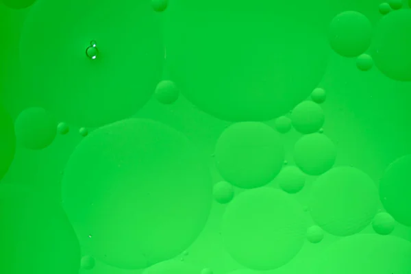 Abstrakt Bakgrund Med Gröna Oljecirklar Och Lutning — Stockfoto