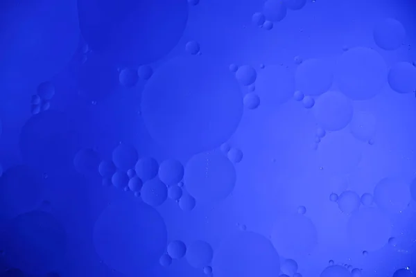 油の円 縞とグラデーションと青の抽象的な背景 — ストック写真