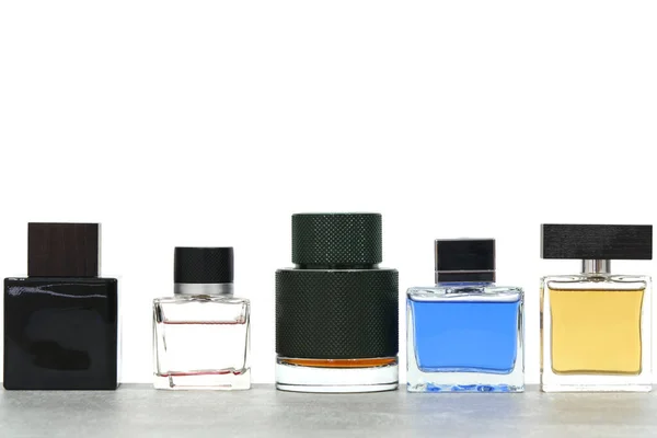 Sok Parfüm Palack Üveg Kék Fekete Zöld Sárga Fehér Háttér — Stock Fotó