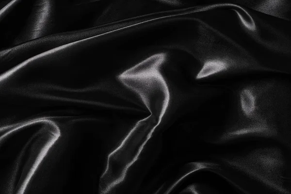 絹織物 抽象波状黒サテン生地の背景 — ストック写真