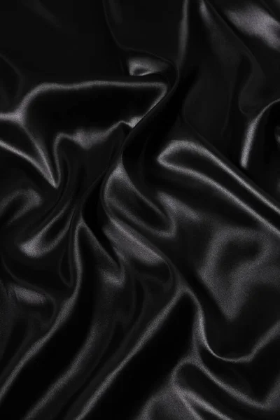 丝绸面料 抽象波纹黑色缎子面料背景 — 图库照片