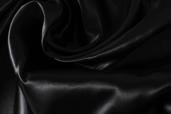 背景黒ツイストシルク生地 抽象的なテクスチャサテン生地 — ストック写真