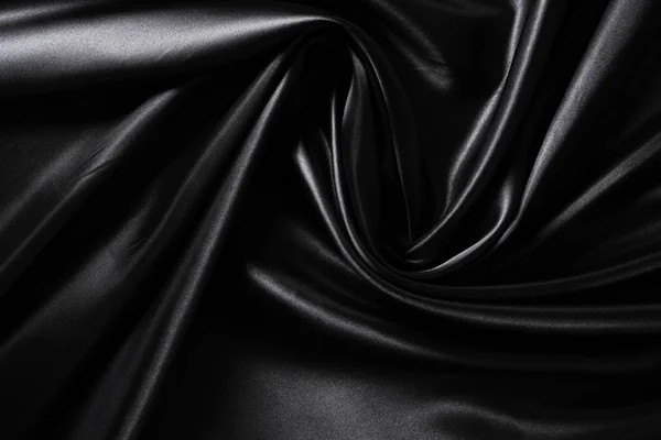 Achtergrond Zwart Gedraaide Zijde Weefsel Abstracte Textuur Satijnen Weefsel — Stockfoto