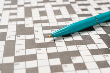 Ballpoint pen is lying crossword puzzle sheet clipart