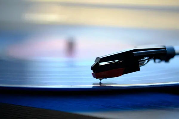 Vinyl record player with record on the background morning light from window with blinds