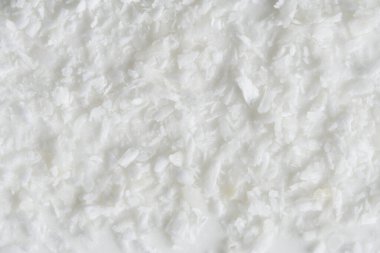 Arka plan, hindistan cevizi kırıntıları beyaz bir jöleye serpilmiş.