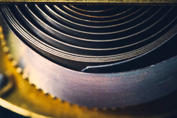 Background with a cocked mechanical spring