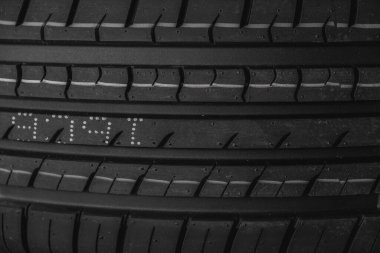Car tire texture background. Black and white car tyre close up clipart