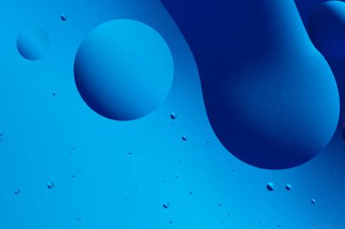 Pürüzsüz çizgiler ve mavi daireler ile soyut eğimli arkaplan