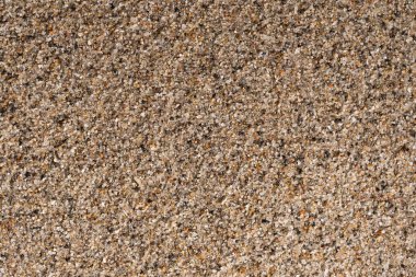 Küçük çakıl taşlarıyla kumun arkaplan dokusu, yakın plan