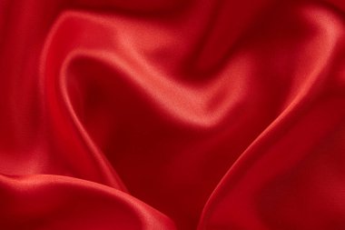 Dalgalı kırmızı saten arka plan. Doku, tekstil, kumaş, kumaş, malzeme, doku