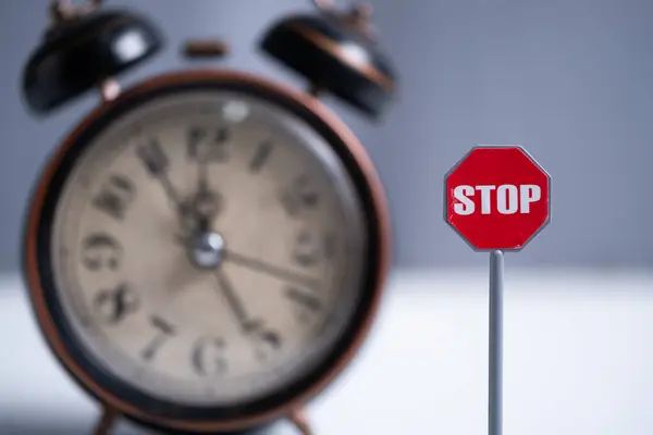 stock image Stop sign with alarm clock on background. Conceptual image