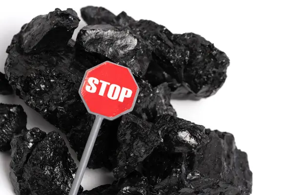 stock image Pile of coal isolated on white background with stop sign. Concept of abandoning coal