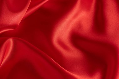 Yumuşak kırmızı ipek ya da saten doku arka plan olarak kullanılabilir