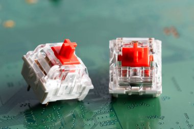 Keys for a mechanical keyboard on a green printed circuit board clipart