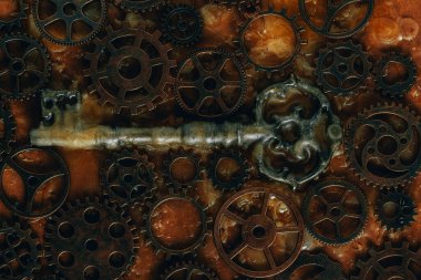 Eski bir anahtar ve paslı mekanik parçaların renkli görüntüsü