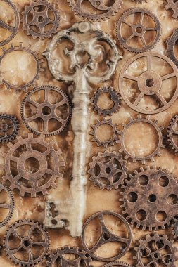 Paslı dişli Grunge arka planı ve eski bir anahtar