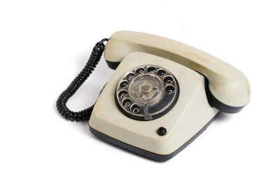 Beyaz arka planda izole edilmiş eski model bir telefon. Retro telefon beyaz arkaplanda izole edildi
