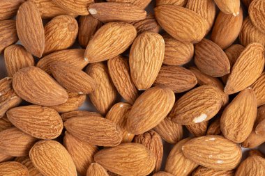 Arka plan olarak badem fıstığı yakın plan. Tüm arka plan. Üst görünüm