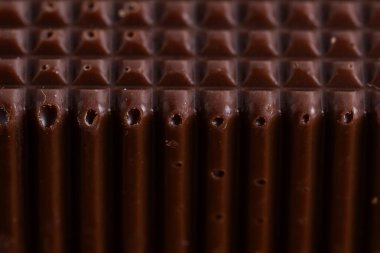 Çikolata desenli arka planı kapatın. Makro çikolatalı.