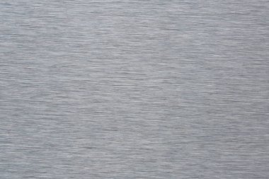 Düz çizgilerle fırçalanmış çelik levhanın soyut arkaplanı veya dokusu