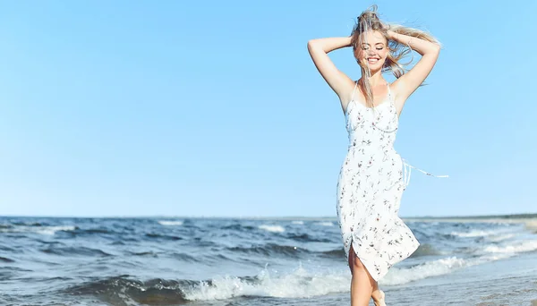 Happy Blonde Beautiful Woman Having Fun Ocean Beach While Dancing Royalty Free Stock Photos