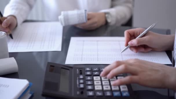 Two Accountants Use Calculator Laptop Computer Counting Taxes Revenue Balance — Stock Video