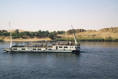 Panoramic view of landscape, flora and fauna around the world largest river Nile while cruising near Aswan in Egypt