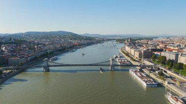 Aerial drone view of Budapest, Hungary, featuring the Chain Bridge and the city beautiful skyline along the Danube River.