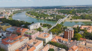 Stunning aerial view of the Ferenc Mora Museum and Belvarosi Bridge in Szeged Hungary showing the Tisza River and surrounding cityscape