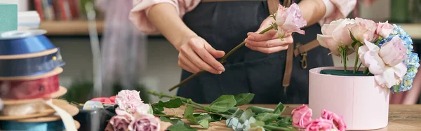 stock image happy professional woman is working in flower shop