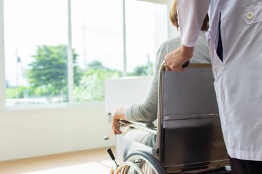 the doctor is examining the patient in the hospital