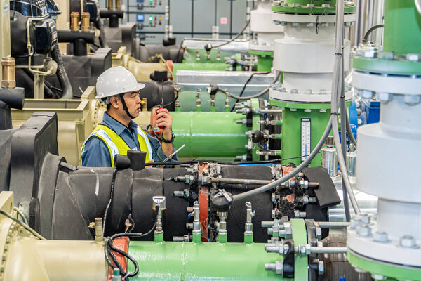 asian man factory technologist. Industrial worker. Chemical plant specialist.