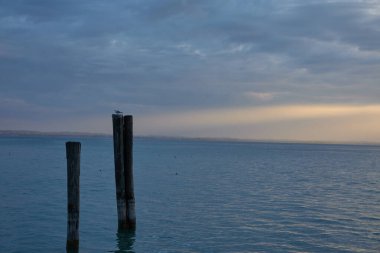  Lazise, Italy - September 25, 2022 - twilight over Lago di Garda in early autumn                              