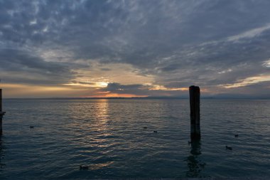  Lazise, Italy - September 25, 2022 - twilight over Lago di Garda in early autumn                              
