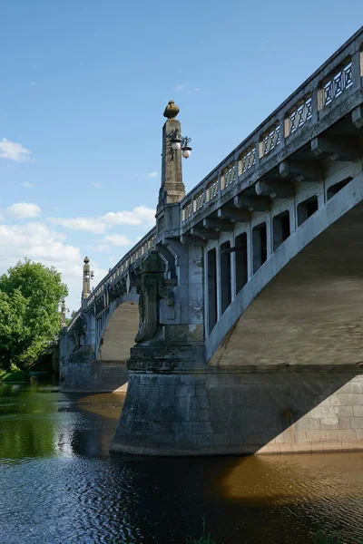 stock image Nymburk, Czech Republic - May 30, 2023 - the road bridge in Nymburk carries the road over the Elbe, on a sunny spring afternoon                                