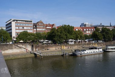 Bremen, Germany - September 1, 2024 - Riverside view of the Schlachte promenade on a sunny summer day                               