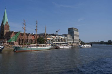 Bremen, Germany - September 1, 2024 - Riverside view of the Schlachte promenade on a sunny summer day                                clipart