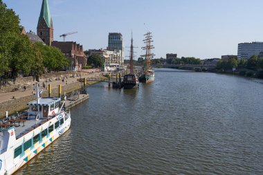 Bremen, Germany - September 1, 2024 - Riverside view of the Schlachte promenade on a sunny summer day                                clipart