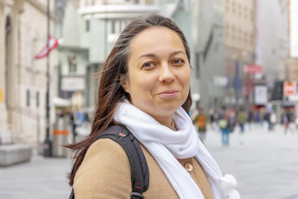 stock image Street portrait of a 40-45-year-old woman on a blurry background of a European city.