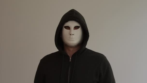 Man Wearing White Mask Black Hooded Hooded Balaclava White Background — Stock Video