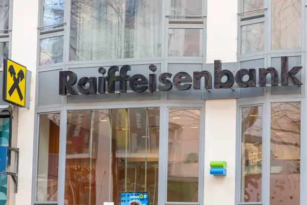 stock image Vienna Raiffeisen Bank Vienna branch lettering and logo on a sunny day; Austia, Vienna, January 29, 2024.