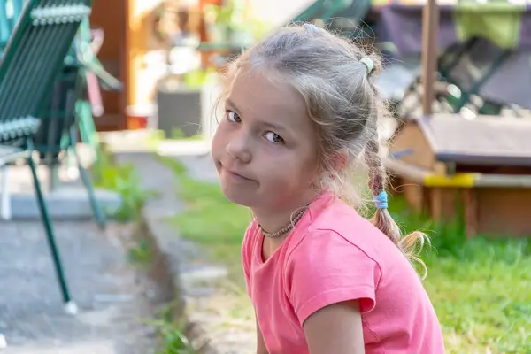 stock image Emotional portrait of a 6 year old girl looking at the camera.