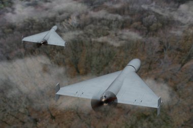 Bir çift dron iş başında. Yoğun orman üzerinde saldırı robotları.
