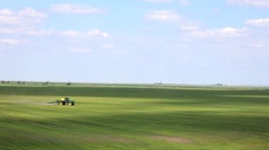 A special tractor treats the field with flax. View from the top. High quality photo